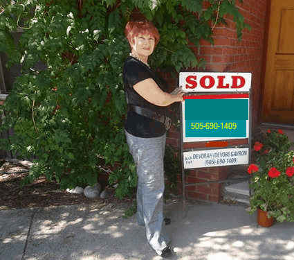 real estate sold sign.